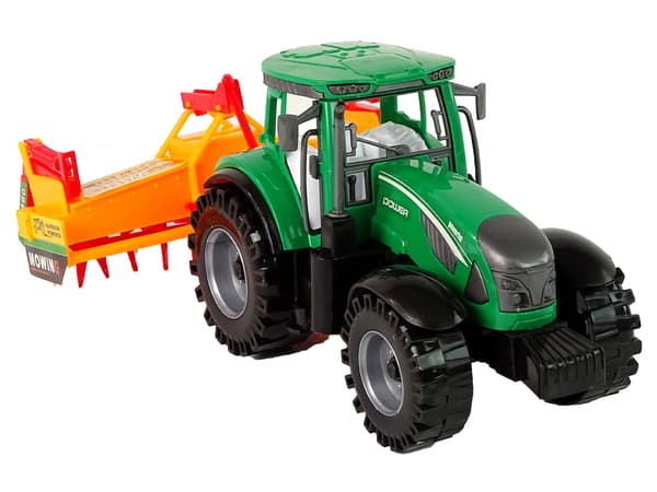 Grön traktor med orange kultivatordrift för barn