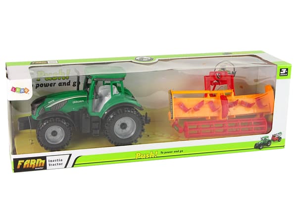 Grön traktor med orange kultivatordrift för barn