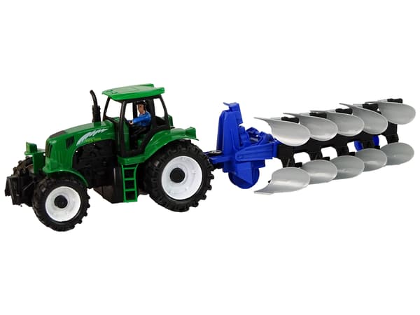 Grön traktor med ploggård