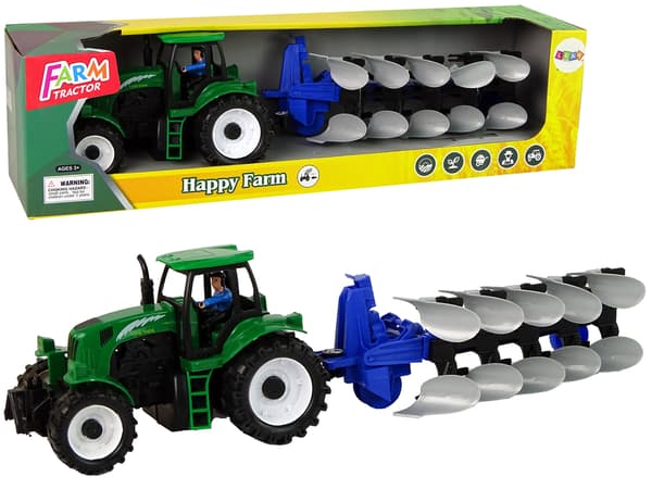 Grön traktor med ploggård