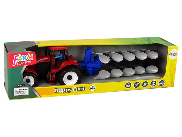 Röd traktor med ploggård