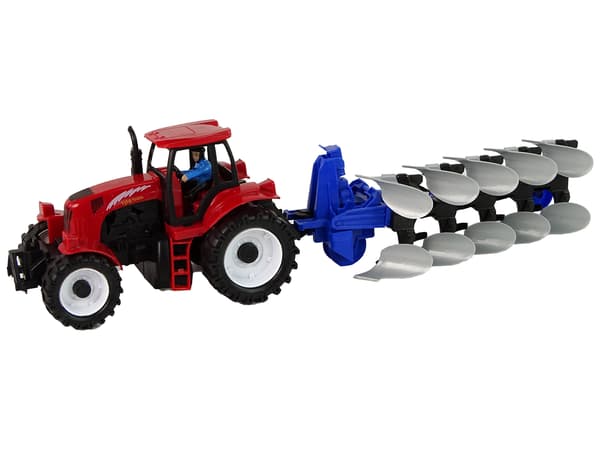 Röd traktor med ploggård