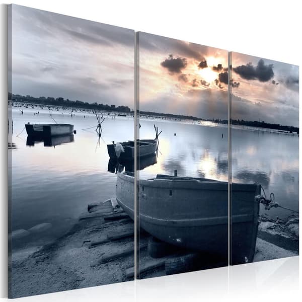 Canvas Tavla - A small boat by a lake