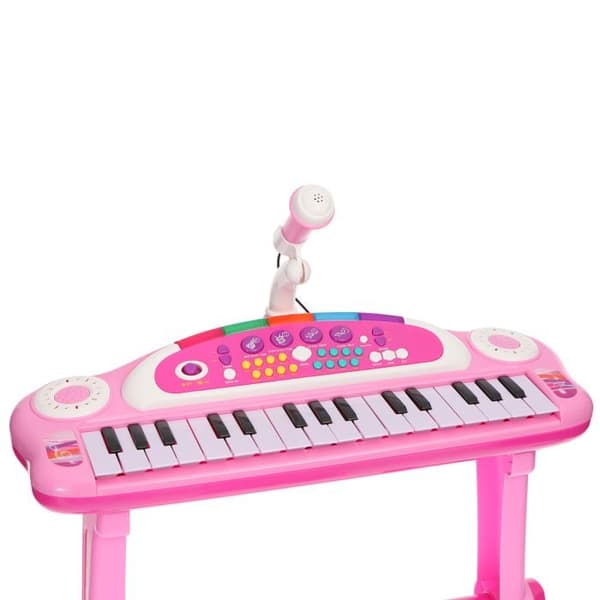 Musikklaviatur med rosa mikrofon