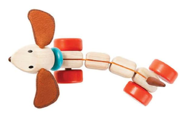 Glada valpen - dragleksak av trä från Plantoys