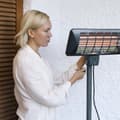 Miniatyrbild 4 av 5: Cecotec Halogen stand or wall heater, 2000 W, for outdoors use. Quartz. IP24. Remote control. 7-hour timer. 2 power levels. Adjustable height.