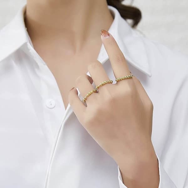 Anti-stress ring med 10 drejelige perler Guld 17,4 mm