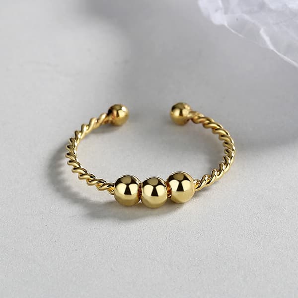 INF Justerbar antistressring med roterbare perler Gull