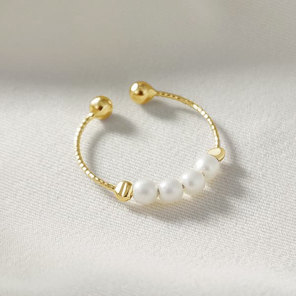 INF Justerbar anti-stress ring med drejelige perler Guld S