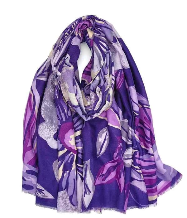 A scarf with flowers and leaves in several colors