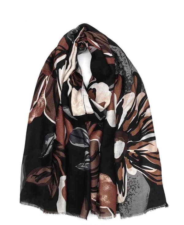 A scarf with flowers and leaves in several colors