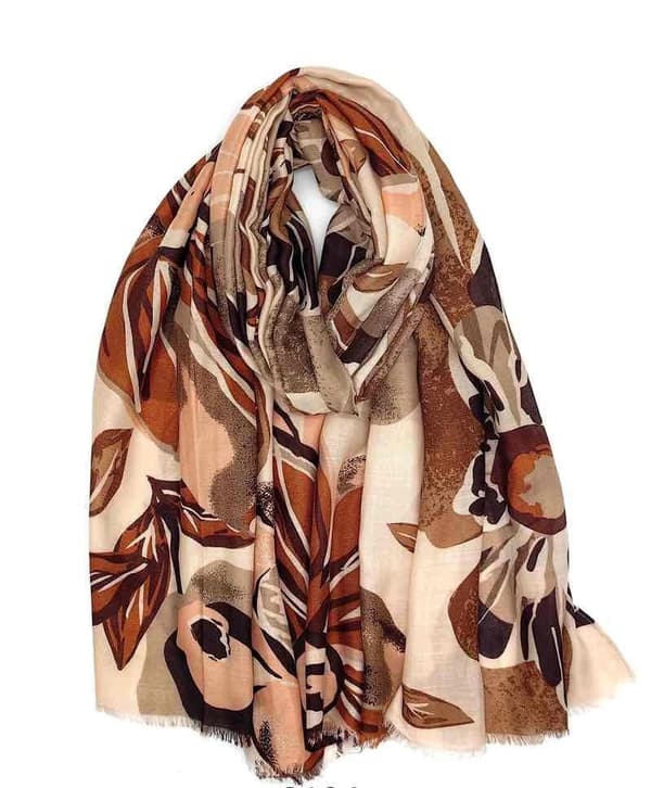 A scarf with flowers and leaves in several colors