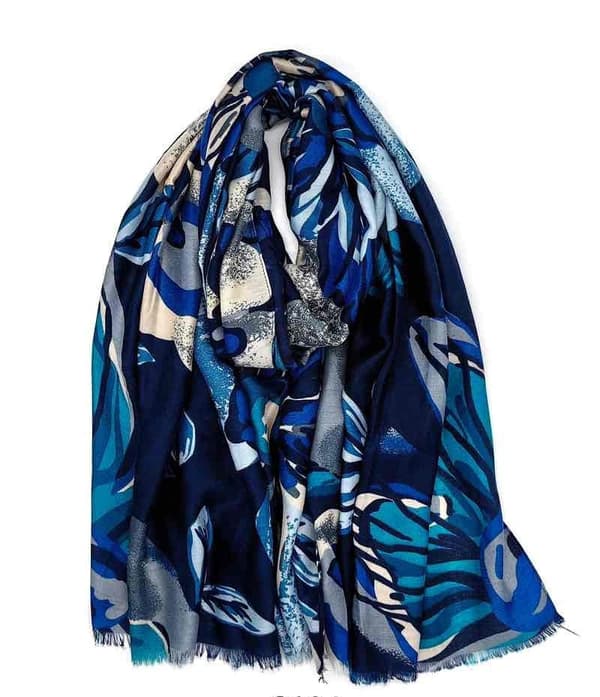 A scarf with flowers and leaves in several colors