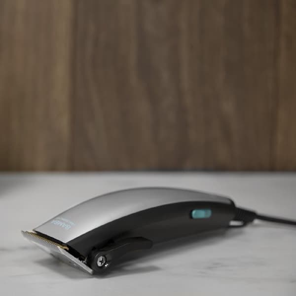 Cecotec Corded hair clipper with titanium-coated waterproof blades and 9 guide combs.