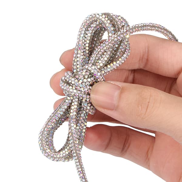 INF Glitrende rhinestone skolisser 140 cm (par)