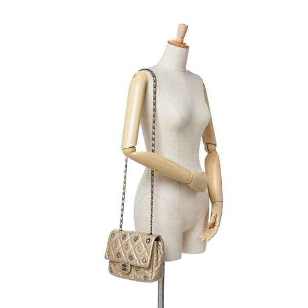 Pre-owned Chanel Paris-Dubai Small Perforated Metallic Lambskin Medals Flap Gold