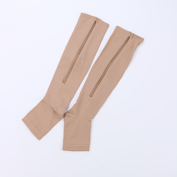 INF Kompressiosukat vetoketjulla ja avoimella kärjellä nylon/spandex beigeä kokoa S/M 1 pari