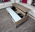 Miniatyrbilde 6 av 6: Allan sofabord med heve funksjon i bordplaten, plass til oppbevaring. Hvit glassplate, eik dekor og metall stell.