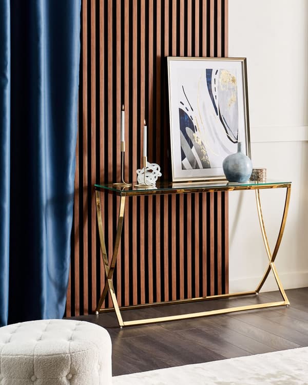Konsolbord i guld med stel i rustfrit stål og glasplade i glamourstil