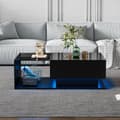 Miniatyrbillede 1 af 11: Sofabord i sort højglans 100x50x32 cm med glasplade, skuffe og LED-belysning – ridsefast, moderne stil
