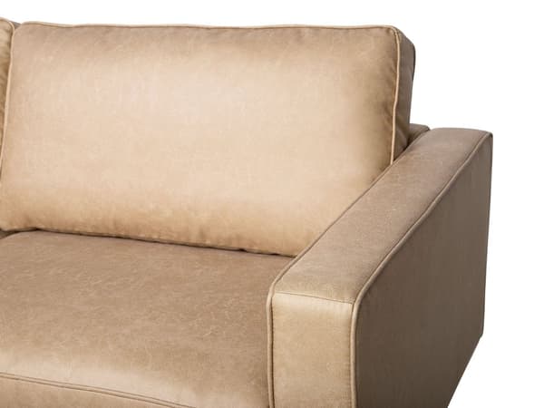 Sohva beige keinonahka verhoiltu metallijalat kolmelle tyynyt tarranauhalla moderni tyyli
