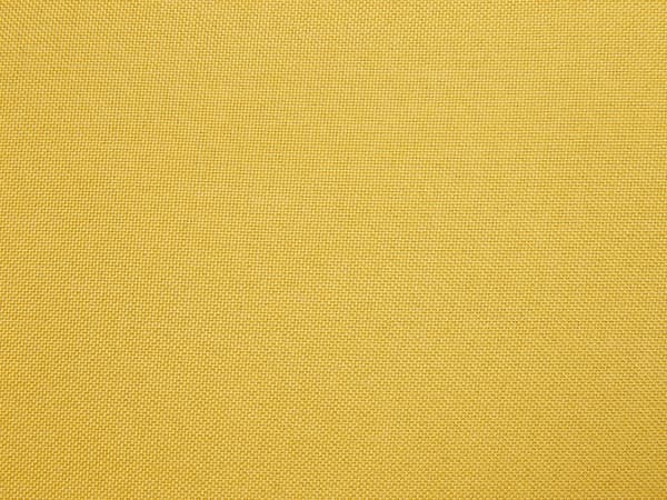 Sohva keltainen kangas verhoiltu kolmelle eukalyptusrunko kumipuujalat minimalistinen retro