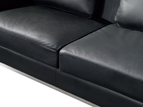 Hjørnesofa med svart skinnpolstring og ottoman L-formet venstreorientering