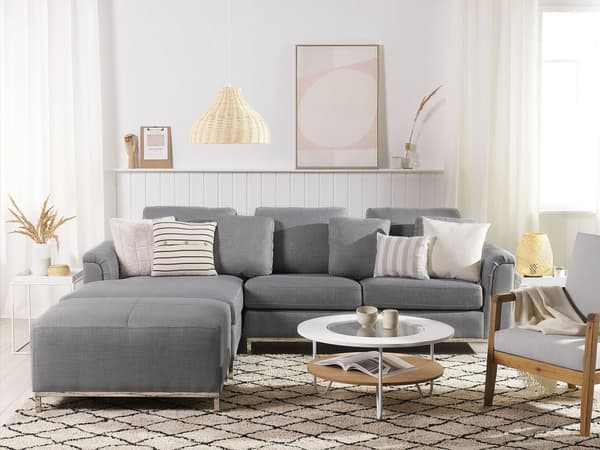 Hjørnesofa i grått stoff med ottomansk L-formet høyreorientering