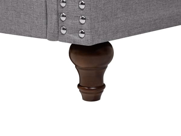 3-seters sofa i grått stoff med lav rygg i Chesterfield-stil