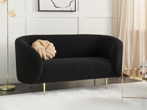 Sohva musta bukleekangas verhoiltu kultaiset rautajalat kahdelle pörröinen kaareva perinteinen glamour tyyli