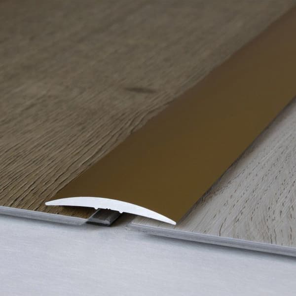Profil för övergångsrail 37 mm typ 07 anodiserad aluminium guld-900- självhäftande