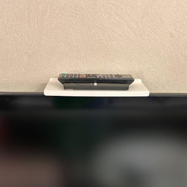 Tv top remote control hanger organizer