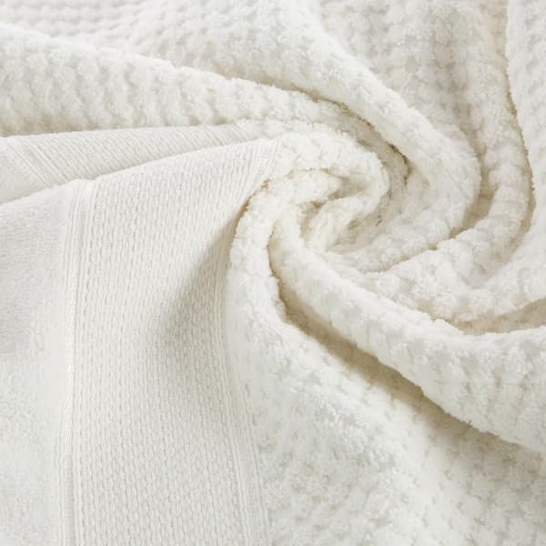 Jessi handduk 70x140 krämfrotté 500g/m2 med präglad rutig textur och velourkant Eurofirany