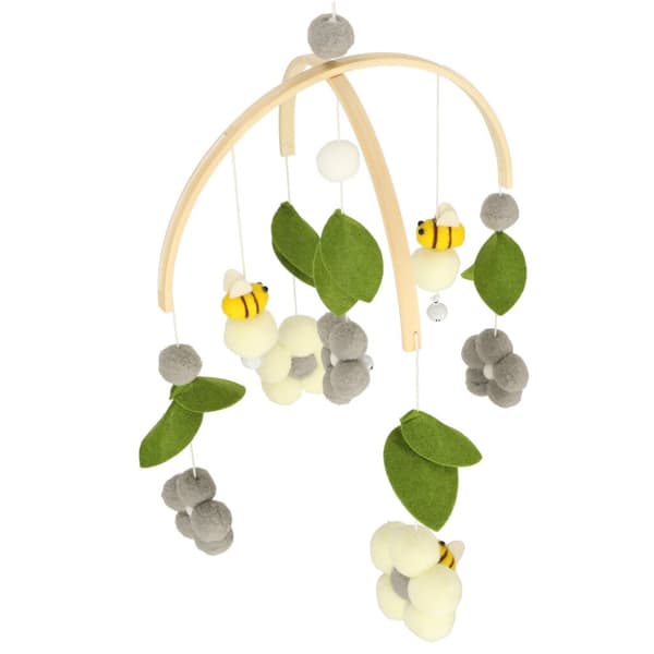 Träsängkarusell med plyschbi- och blomhängen