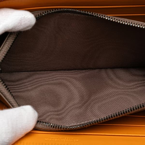 Pre-owned Bottega Veneta Leather Intrecciato Zip Around Wallet Orange