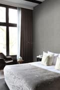 Miniatyrbild 2 av 8: Origin Wallcoverings tapet tvärsnitt trädstammar mörkgrått 53 cm x 10,05 m